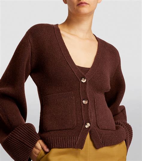 khaite scarlet cashmere cardigan.